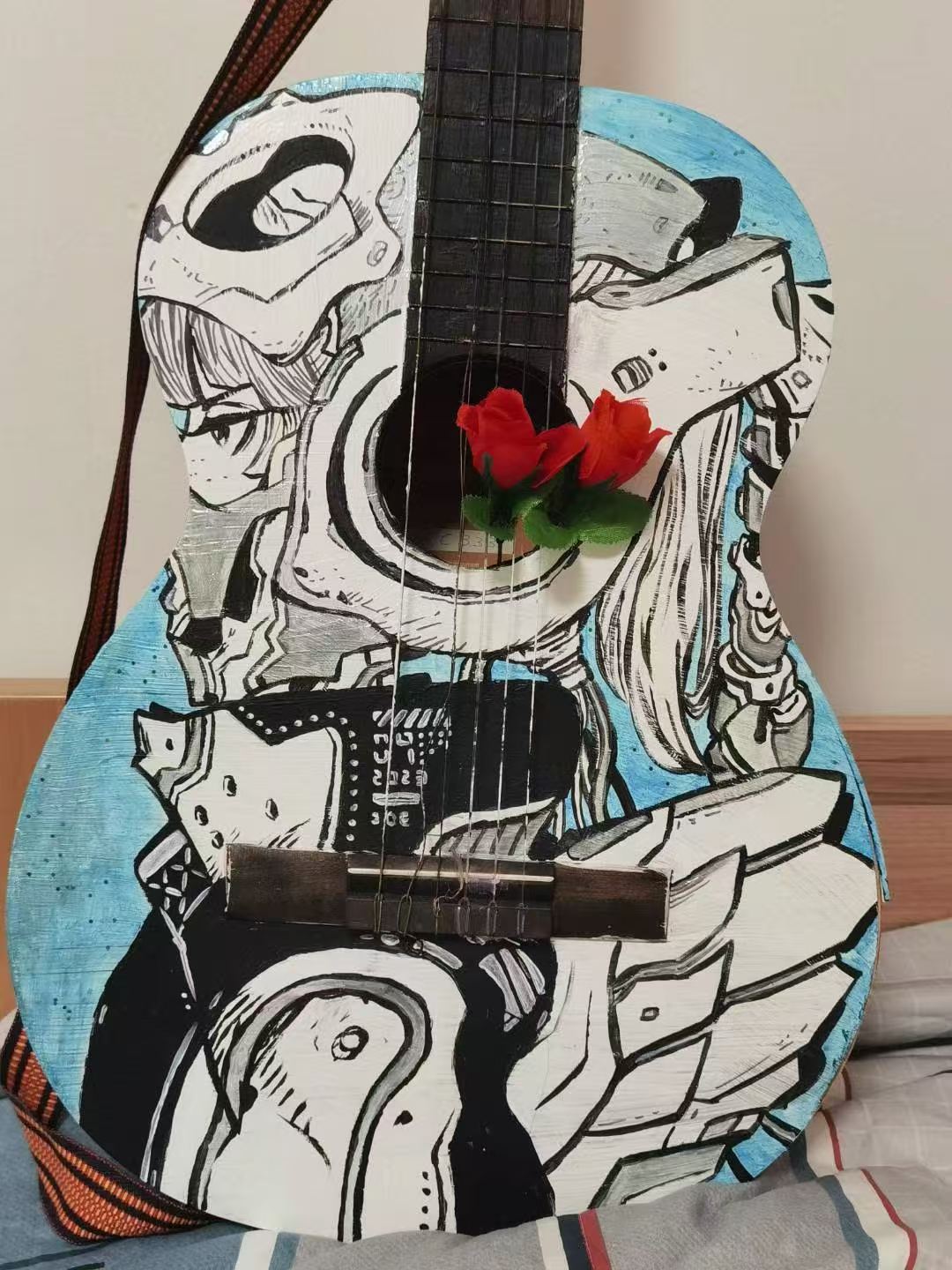 A guitar decorated with an original illustrated character design